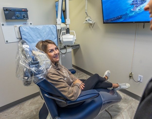 Smiling male dental patient with denim jacket