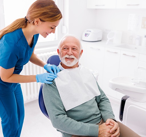 Senior man getting ready for dental treatment