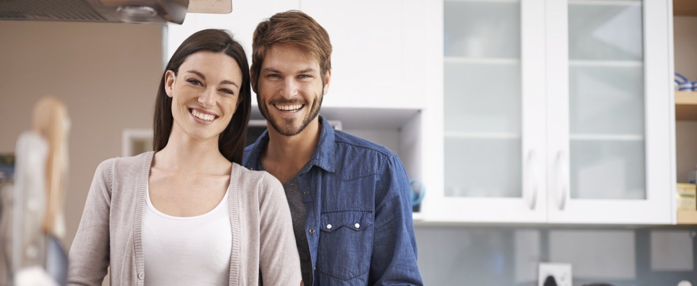 Man and woman smiling in dental office in Orlando