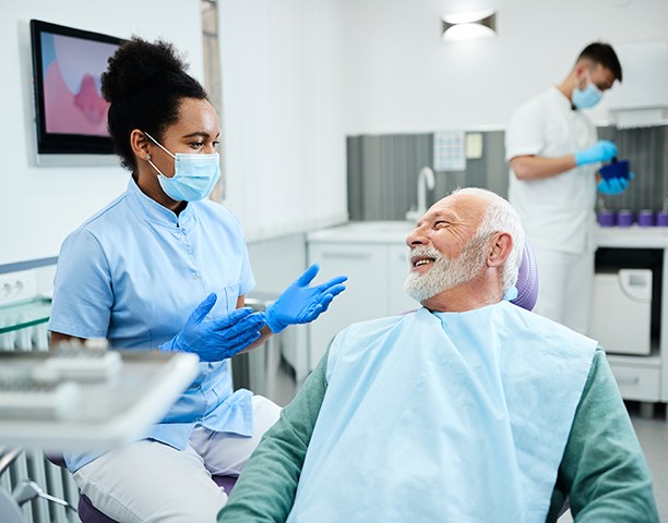 Man smiling at dentist in treatment chair